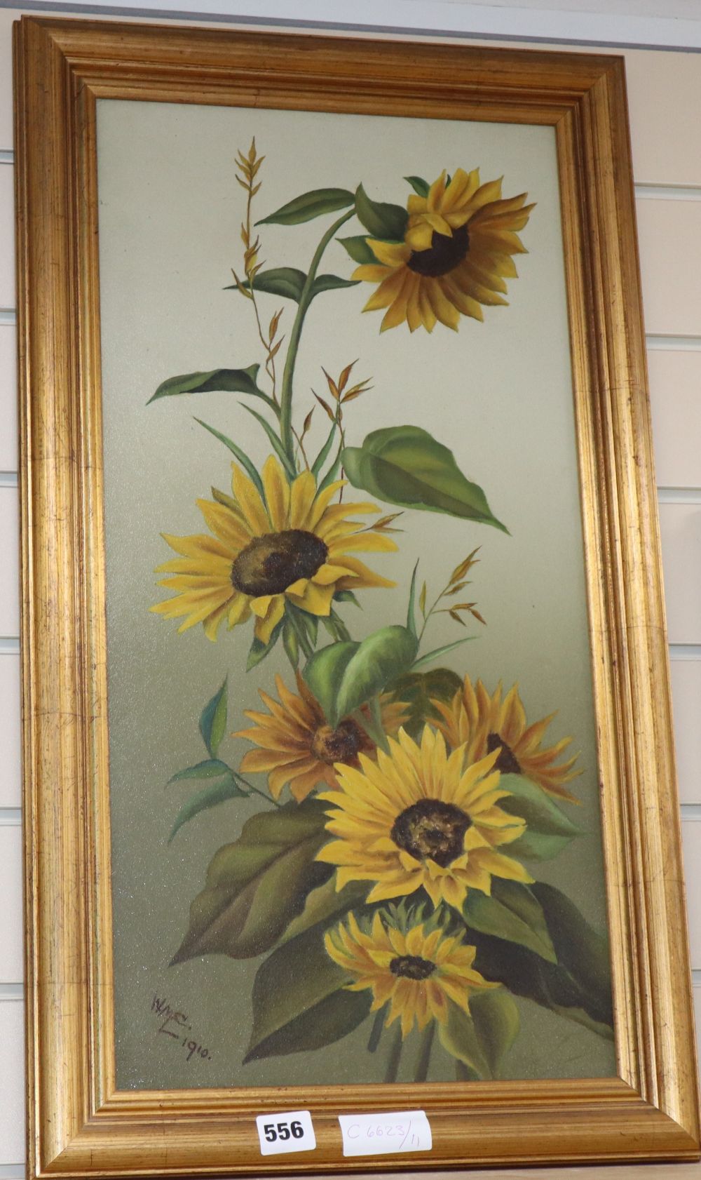 WMC, early 20th century, oil on board, Study of sunflowers, initialed WMC and dated 1910, 59 x 29cm